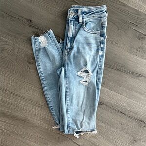 American Eagle Outfitters Super High Rise Light Blue Distressed Jeans